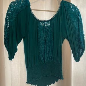 Stunning teal crop top with lace detail! Perfect for a holiday party!